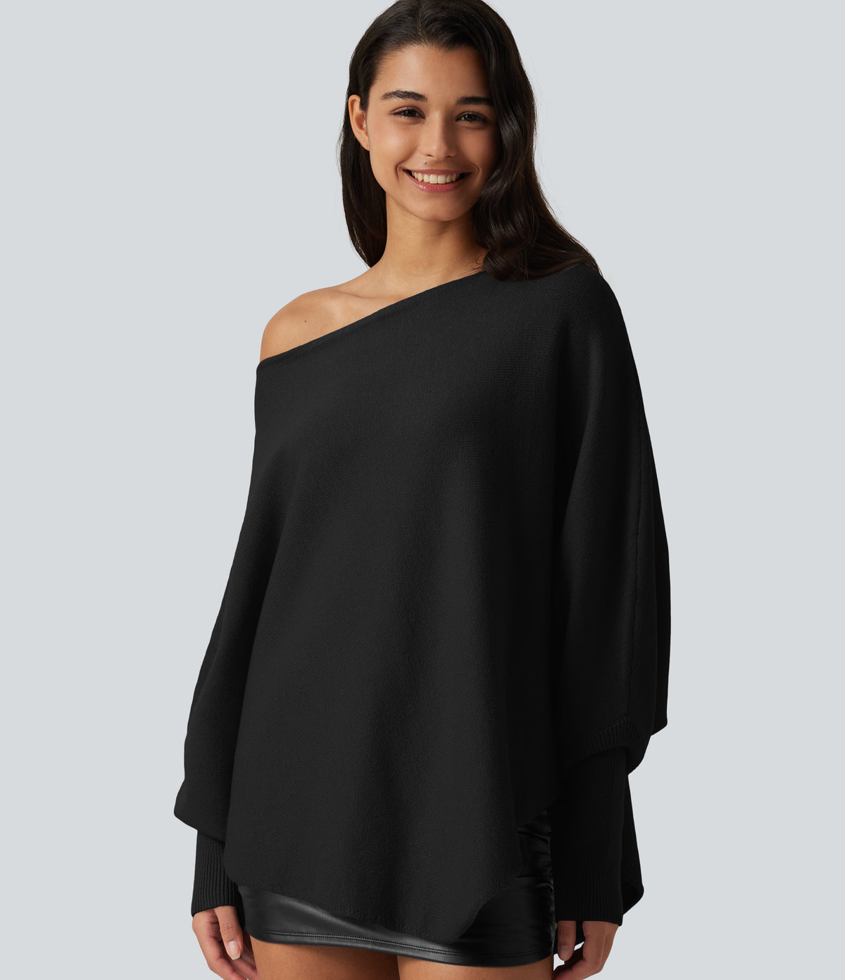 Jersey oversize con mangas murciélago y bajo asimétrico - Negro