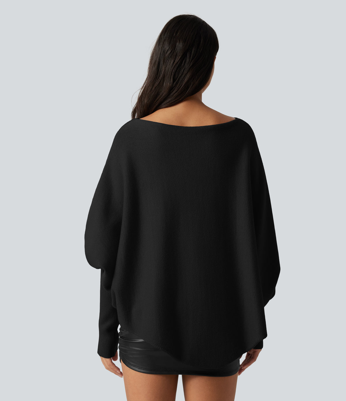 Jersey oversize con mangas murciélago y bajo asimétrico - Negro