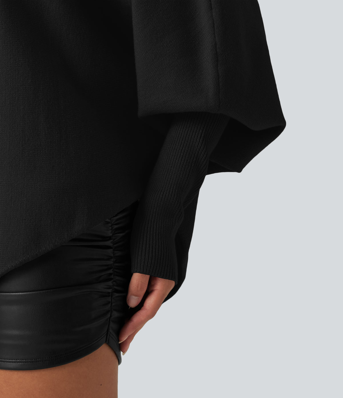 Jersey oversize con mangas murciélago y bajo asimétrico - Negro