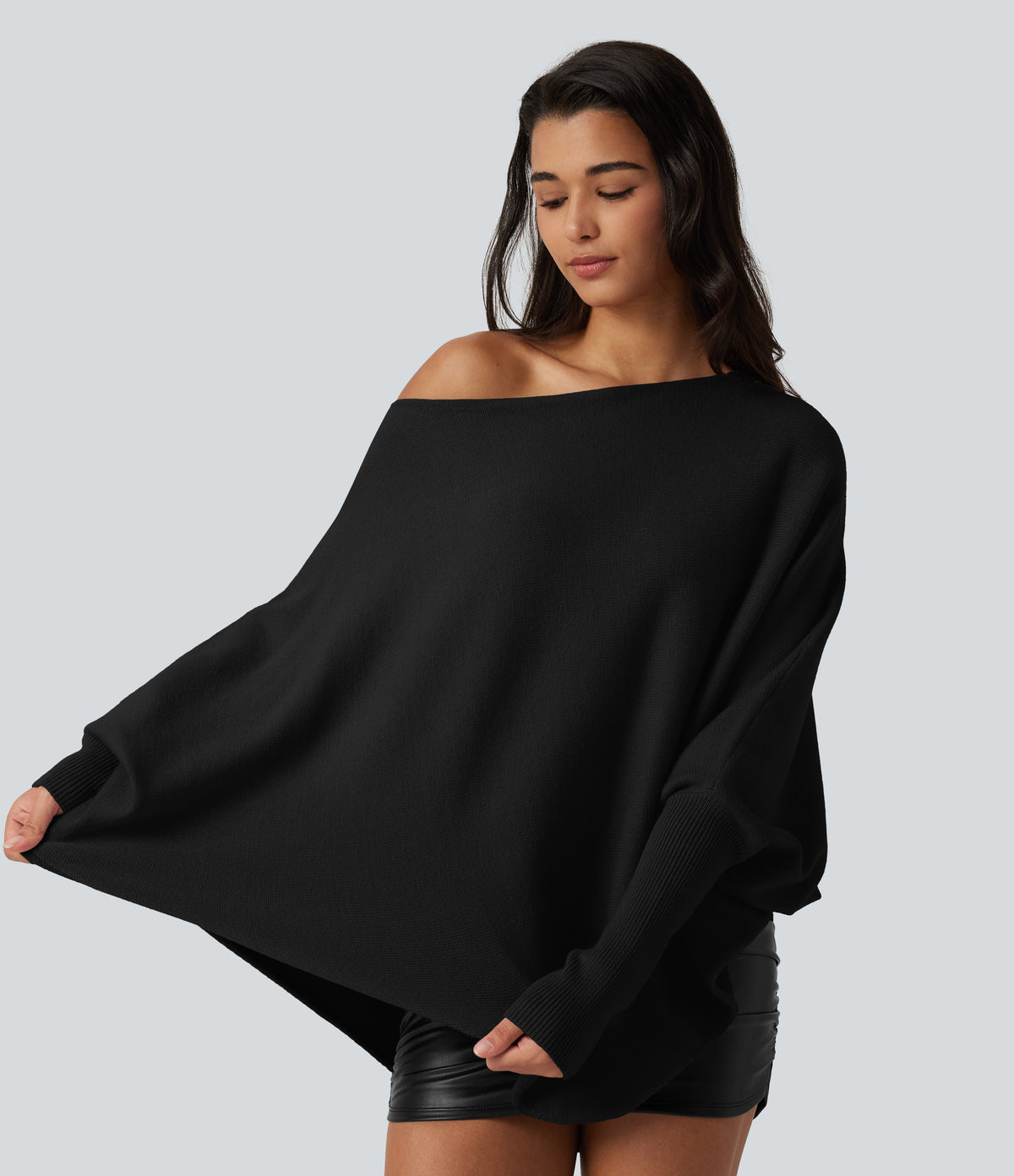 Jersey oversize con mangas murciélago y bajo asimétrico - Negro